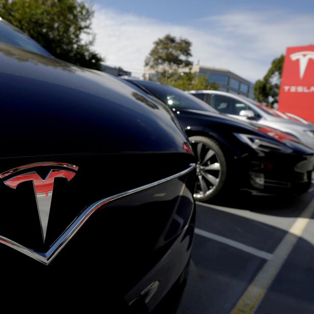 FILE PHOTO: A Tesla Model X is seen alongside a Model S at a Tesla electric car dealership in Sydney