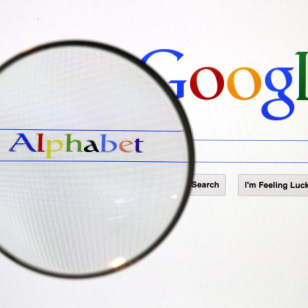 FILE PHOTO: A Google search page is seen through a magnifying glass in this photo illustration taken in Berlin