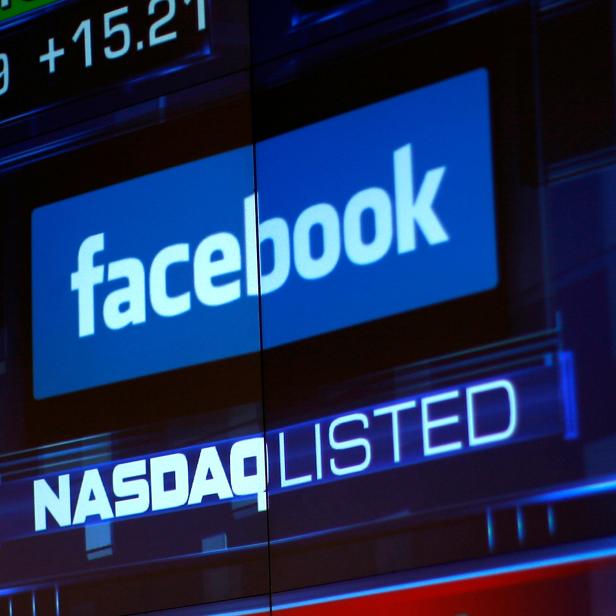 FILE PHOTO: Monitors displays the Facebook, Inc. stock during morning trading at the NASDAQ Marketsite in New York