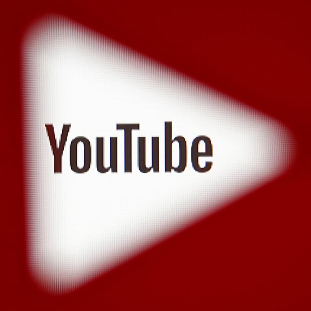 FILE PHOTO:    A 3D-printed YouTube icon is seen in front of a displayed YouTube logo in this illustration