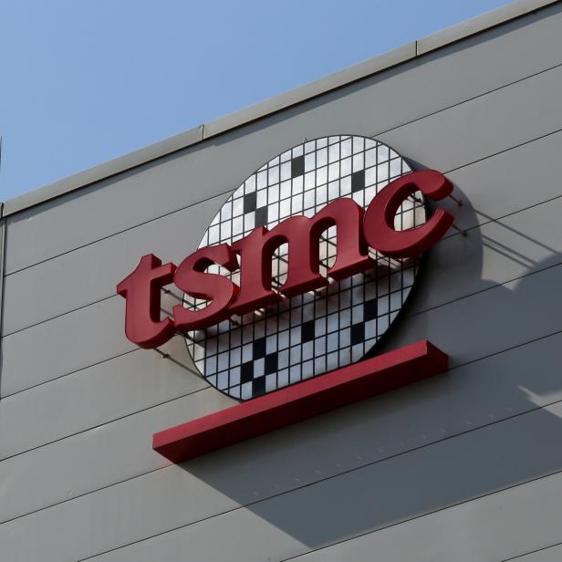 A logo of Taiwan Semiconductor Manufacturing Co (TSMC) is seen on a wall of its headquarters in Hsinchu