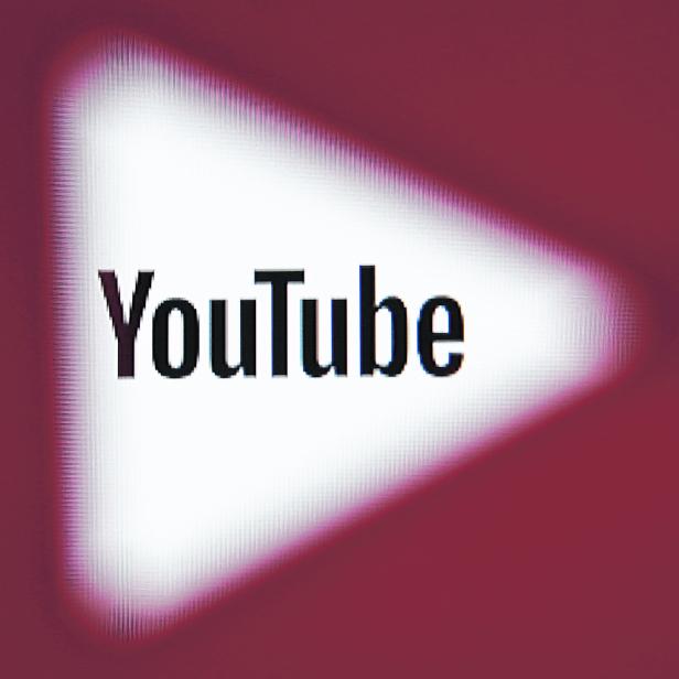 FILE PHOTO:    A 3D-printed YouTube icon is seen in front of a displayed YouTube logo in this illustration