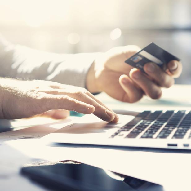 Photo businessman working with generic design notebook. Online payments, banking, hands keyboard. Blurred background, film effect. horizontal mockup