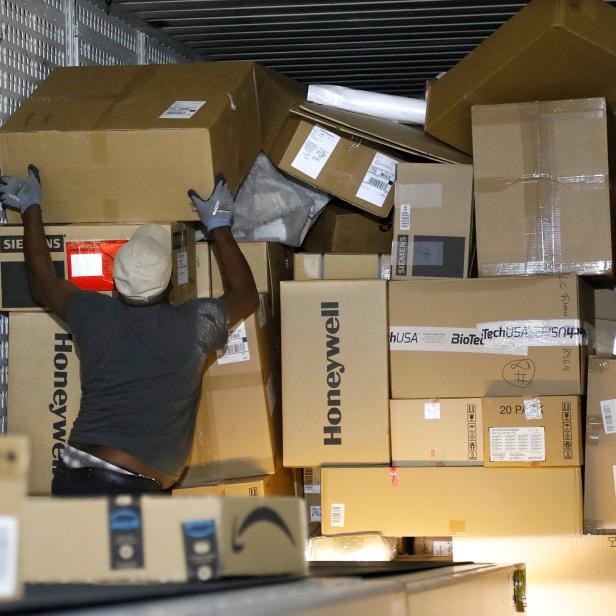 An United Parcel Service employee works at the new package sorting and delivery UPS hub in Corbeil-Essonnes and Evry