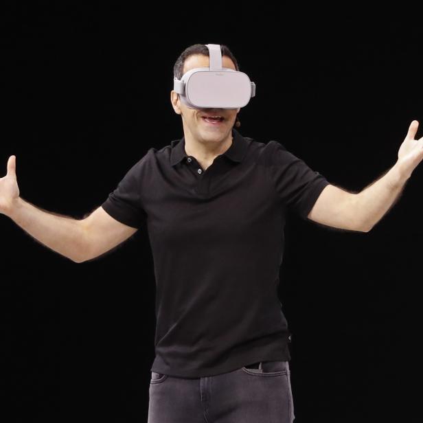 Facebook Vice President of Virtual Reality Hugo Barra wears an Oculus headset at Facebook Inc's annual F8 developers conference in San Jose