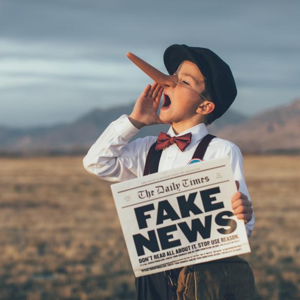 Old Fashioned Pinocchio News Boy Holding Fake Newspaper