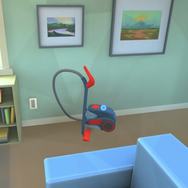 Ein blauer Staubsauger steht in einem Wohnzimmer mit Bildern an der Wand.