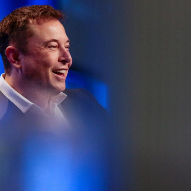 Tesla and SpaceX CEO Musk smiles during a "fireside chat" at the NLC 2018 City Summit in Los Angeles