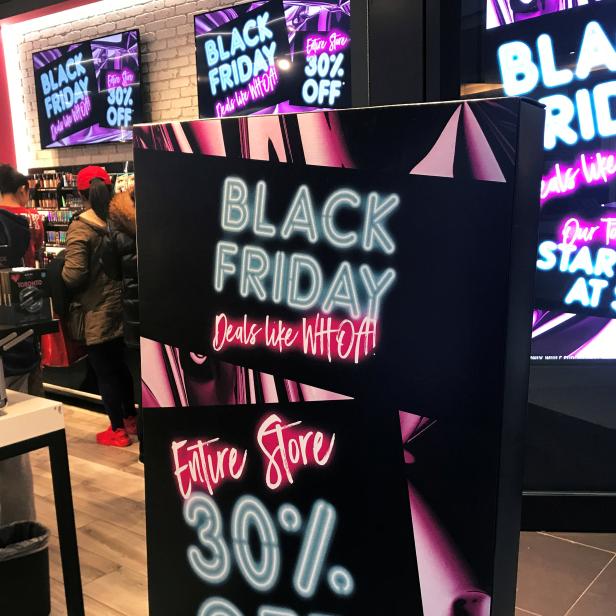 FILE PHOTO: A Black Friday sale sign is displayed outside a makeup store at Roosevelt Field shopping mall in Garden City