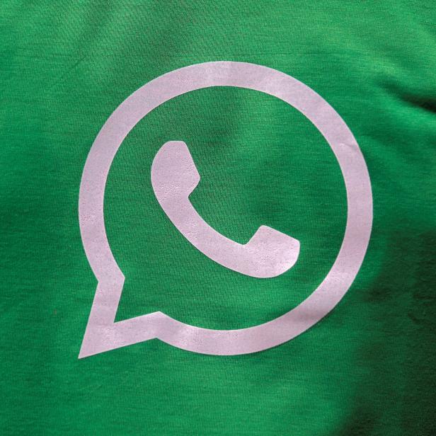 A logo of WhatsApp is pictured on a T-shirt worn by a WhatsApp-Reliance Jio representative during a drive by the two companies to educate users, on the outskirts of Kolkata