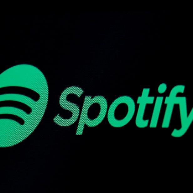 FILE PHOTO: The Spotify logo is displayed on a screen on the floor of the NYSE in New York