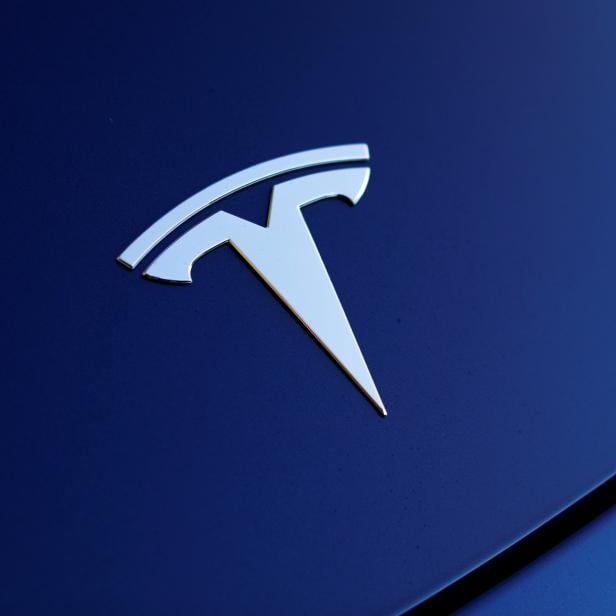 The front hood logo on a 2018 Tesla Model 3 electric vehicle is shown in Cardiff, California