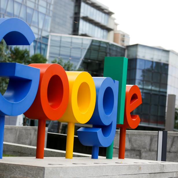 FILE PHOTO: The brand logo of Alphabet Inc's Google is seen outside its office in Beijing