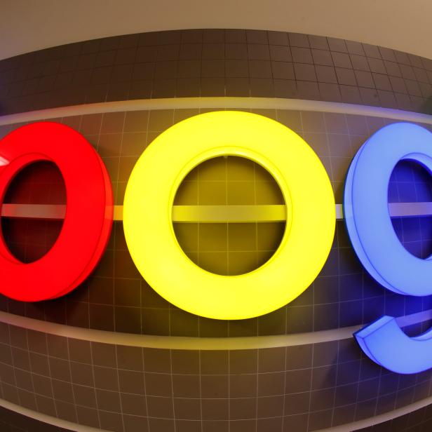 FILE PHOTO: An illuminated Google logo is seen inside an office building in Zurich