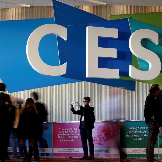 FILE PHOTO: Man takes a selfie in front of the CES logo during the 2018 CES in Las Vegas