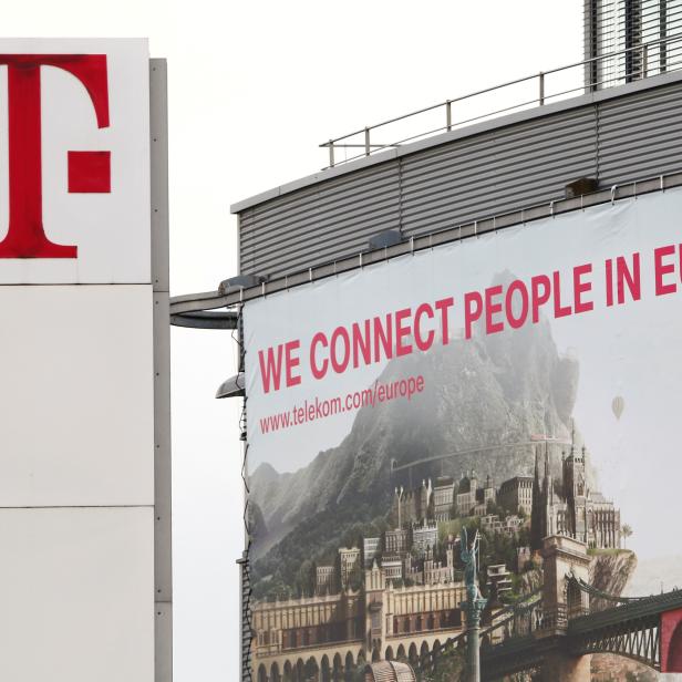 FILE PHOTO: The logo of German telecommunications giant Deutsche Telekom AG is seen at the company's headquarters in Bonn