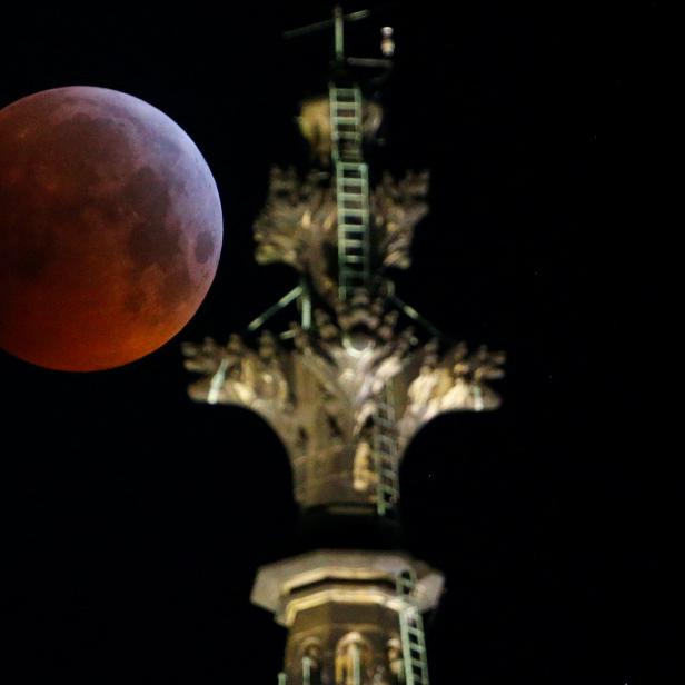 The "super blood wolf moon" is seen during a total lunar eclipse behind the gothic cathedral in Cologne