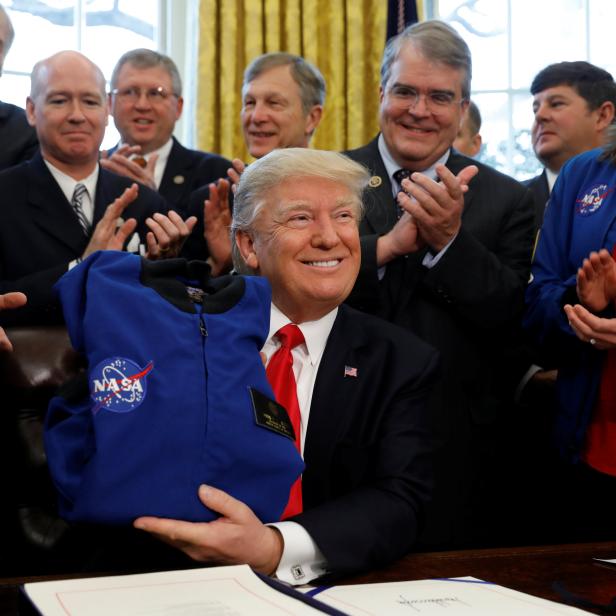 Trump signs NASA act at the White House in Washington