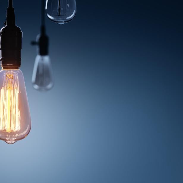 Innovation And Leadership Concept - Glowing Bulb lamp