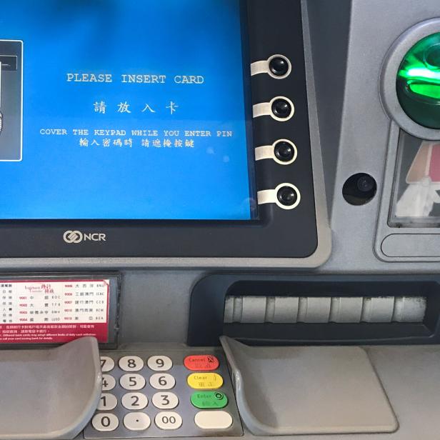 A small camera is installed on the right side of an ATM machine in Macau