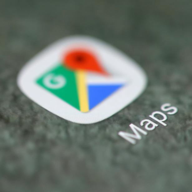 The Google Maps app logo is seen on a smartphone in this illustration