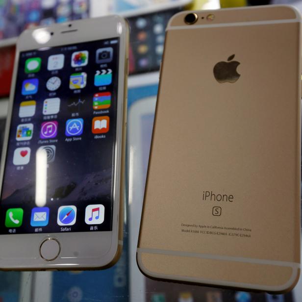 Two fake Apple iPhone 6s, which run the Android operating system with an iOS look-alike interface, selling at RMB 580 ($91) each are seen in a photo illustration taken in Shenzhen