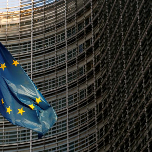 A EU flag is seen outside the EU Commission headquarters in Brussels