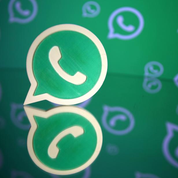 FILE PHTO: A 3D printed Whatsapp logo is seen in front of a displayed Whatsapp logo in this illustration