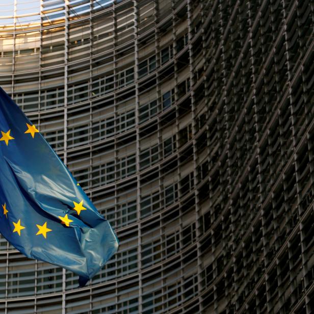 FILE PHOTO: A EU flag is seen outside the EU Commission headquarters in Brussels