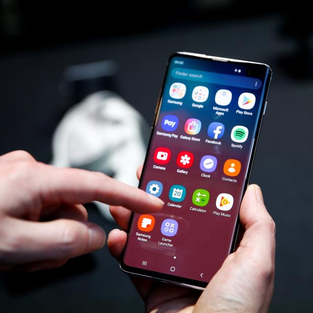 A journalist uses the new Samsung Galaxy S10 smartphone at a press event in London