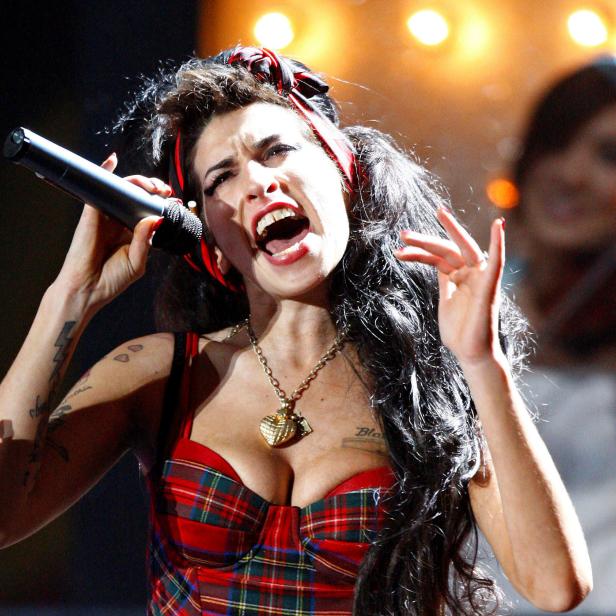 FILE PHOTO: British singer Winehouse performs at the Brit Awards at Earls Court in London