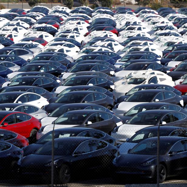 FILE PHOTO: A parking lot of predominantly new Tesla Model 3 electric vehicles is seen in Richmond, California