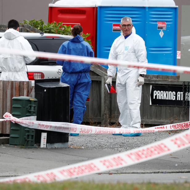 Investigators at the site of Friday's shooting outside the Linwood Mosque in Christchurch, New Zealand