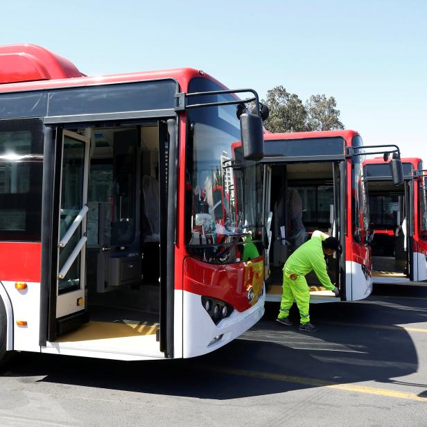 The new fleet of electric buses for public transport manufactured by China's BYD, are parked in a bus terminal in Santiago