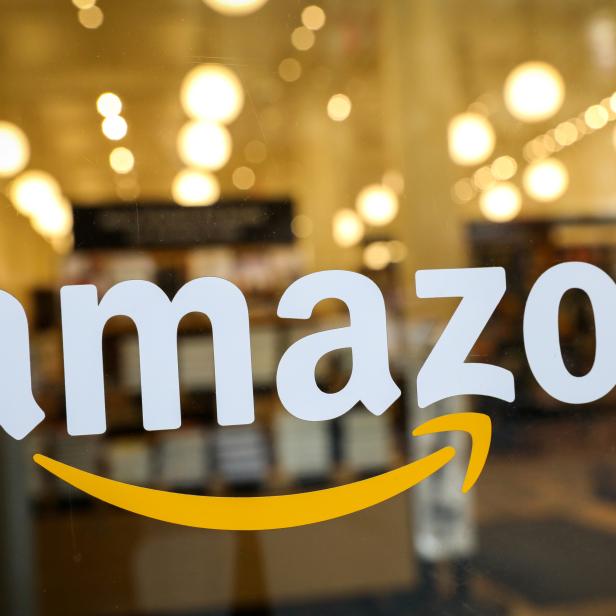 FILE PHOTO: The logo of Amazon is seen on the door of an Amazon Books retail store in New York