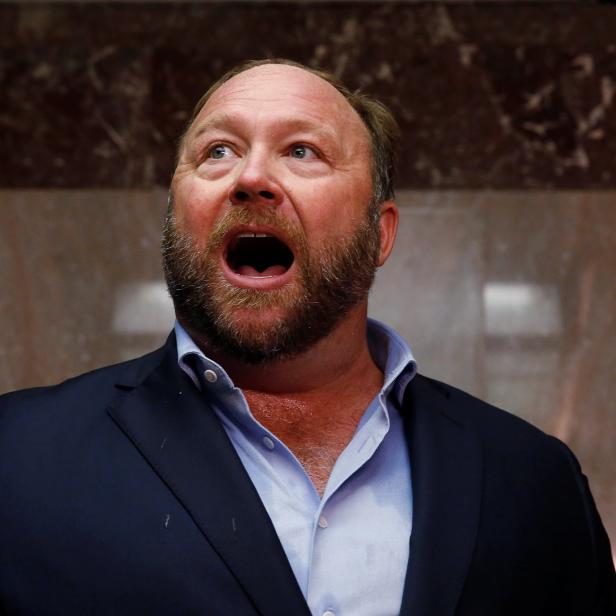 Alex Jones of Infowars talks to the media outside the U.S. Senate Intelligence Committee on Capitol Hill in Washington