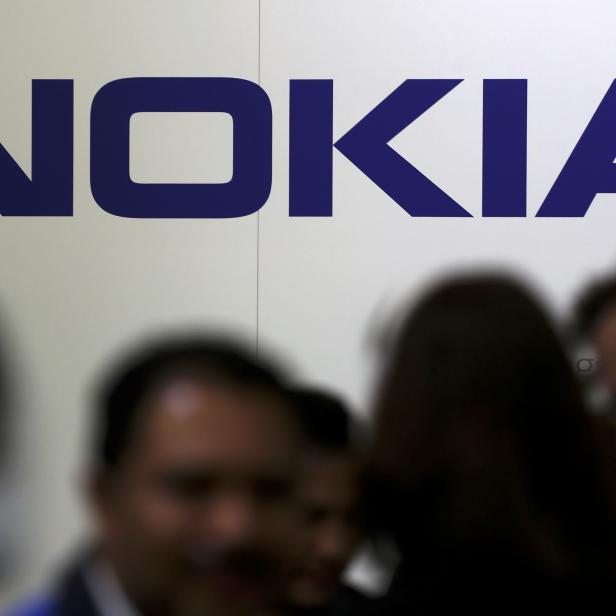 FILE PHOTO: Visitors gather outside the Nokia booth at the Mobile World Congress in Barcelona