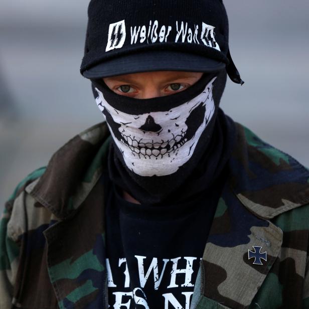 A member of the National Socialist Movement, one of the largest white nationalist type groups in the country, attends a rally at the state capital in Little Rock, Arkansas