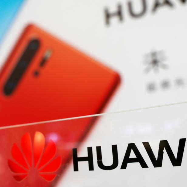 The logo of Huawei is seen at its showroom in Shenzhen