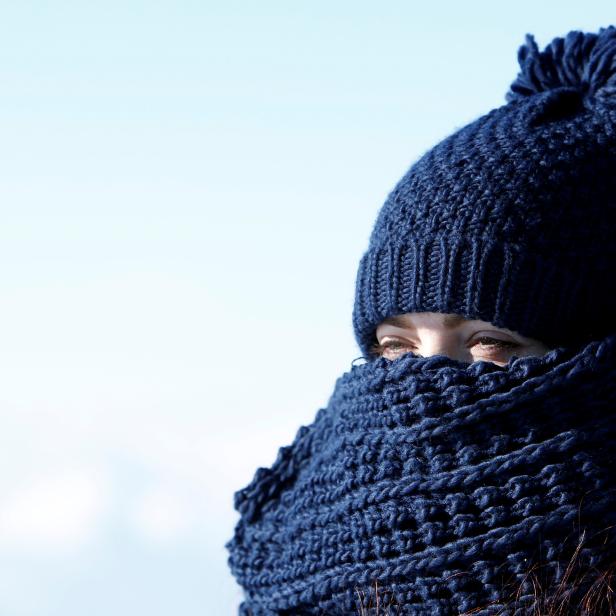 A woman is pictured on top of highest German mountain, the Zugspitze, in Garmisch-Partenkirchen