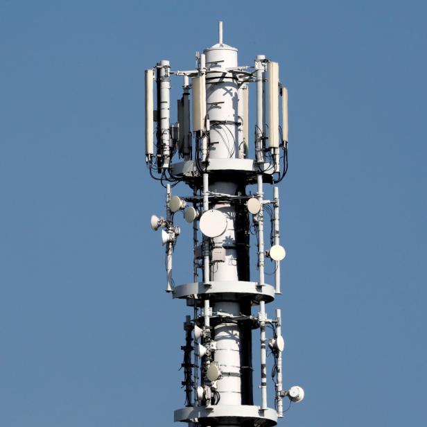 Different types of 4G, 5G and data radio relay antennas for mobile phone networks are pictured on a relay mast operated by Vodafone in Berlin