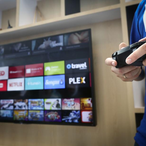 Google employee uses a game controller to demonstrate the features of the newly-announced Android TV at the Google I/O developers conference in San Francisco