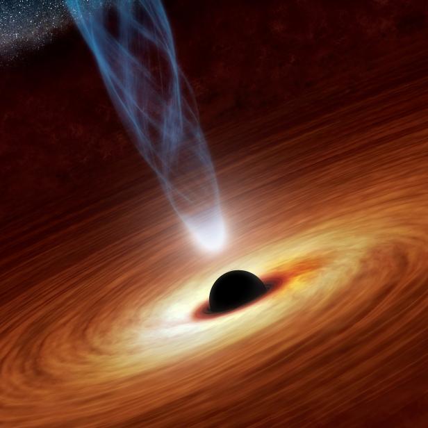 FILE PHOTO: A supermassive black hole with millions to billions times the mass of our sun is seen in an undated NASA artist's concept illustration