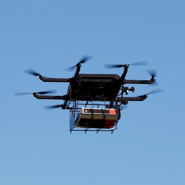 FILE PHOTO: A drone demonstrates delivery capabilities from the top of a UPS truck during testing in Lithia, Florida