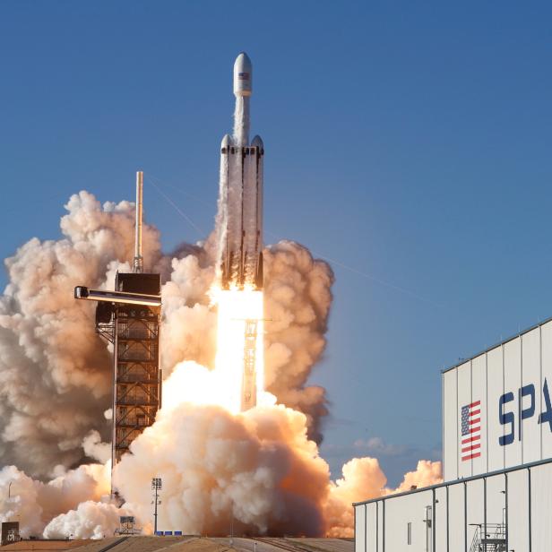 A SpaceX Falcon Heavy rocket, carrying the Arabsat 6A communications satellite, lifts off from the Kennedy Space Center