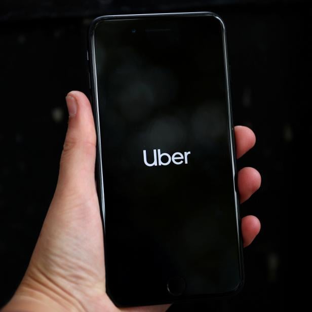 FILE PHOTO: FILE PHOTO: Uber's logo is displayed on a mobile phone in London, Britain