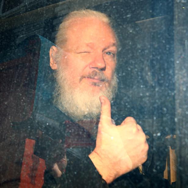 WikiLeaks founder Julian Assange arrives at the Westminster Magistrates Court, after he was arrested  in London