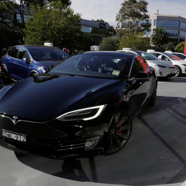 A Tesla Model S electric car is taken for a test drive at a Tesla car dealership in Sydney