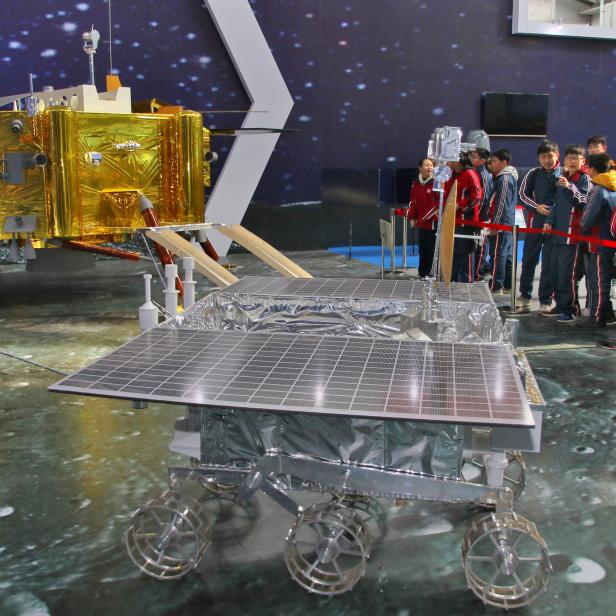 Model of the lunar rover Yutu-2, or Jade Rabbit 2, is displayed next to a model of the moon lander for Chang'e 4 lunar probe, at an aerospace exhibition in Yantai