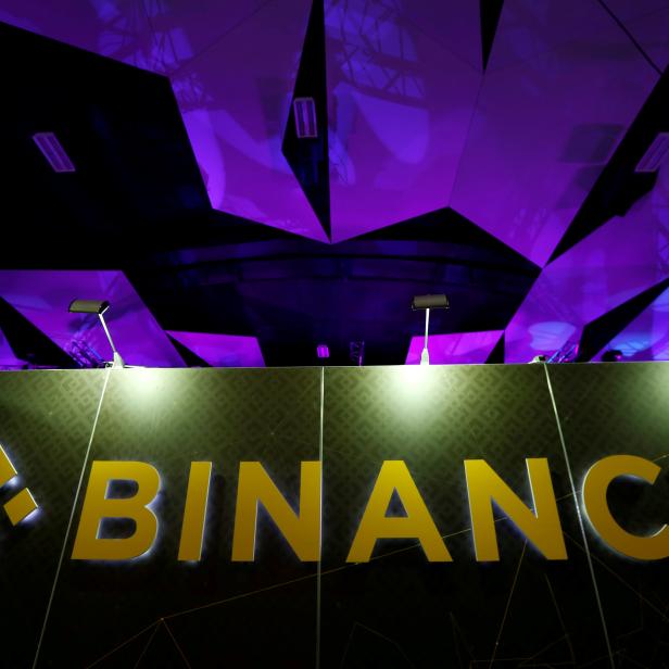 FILE PHOTO: The logo of Binance is seen on their exhibition stand at the Delta Summit, Malta's official Blockchain and Digital Innovation event promoting cryptocurrency, in St Julian's